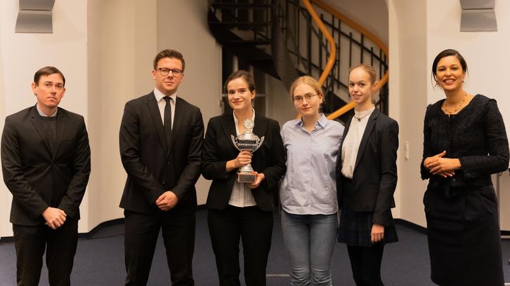 Students lift trophy after triumph in moot Grand Final